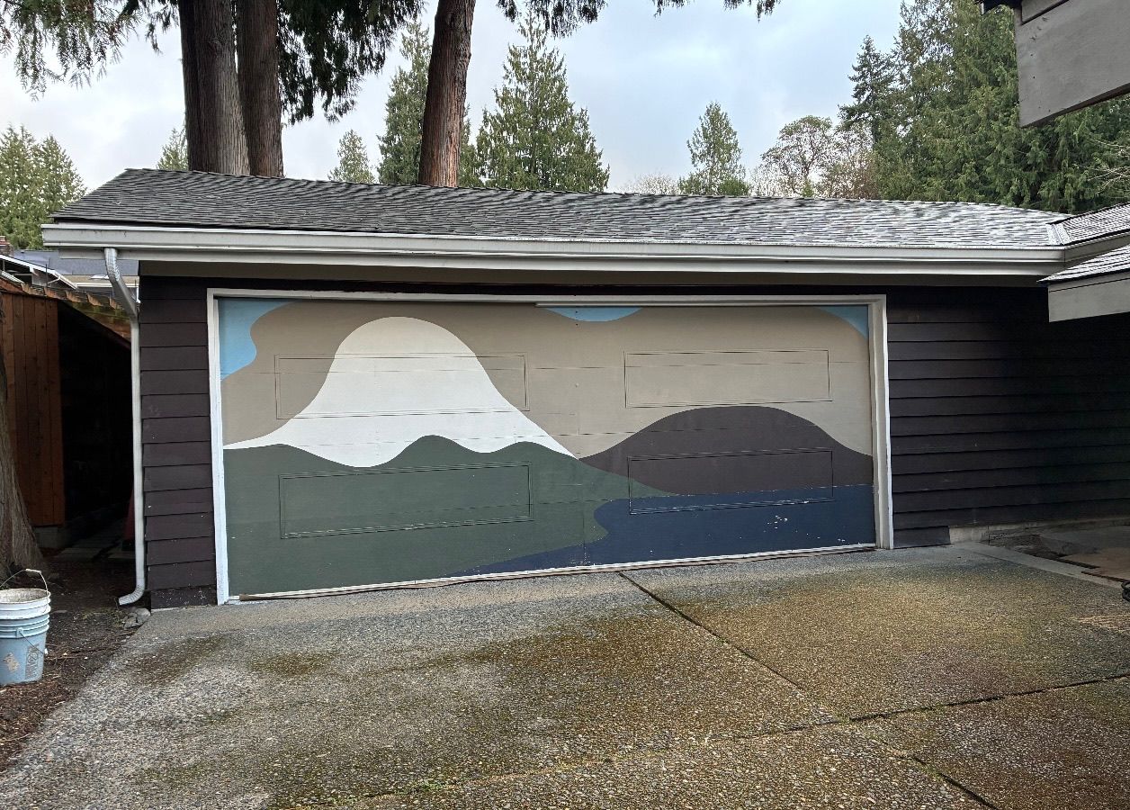 Home with a hand-painted mural garage door before replacement