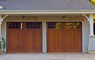 Two-car garage with natural wood carriage-style doors