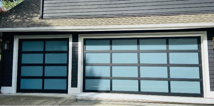 Close-up of a teal-tinted glass garage door