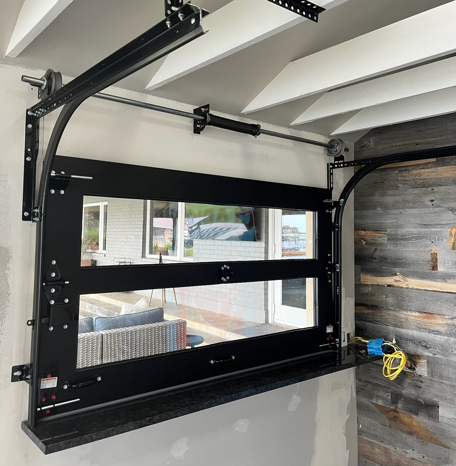 Close-up of a garage door opener track and hardware