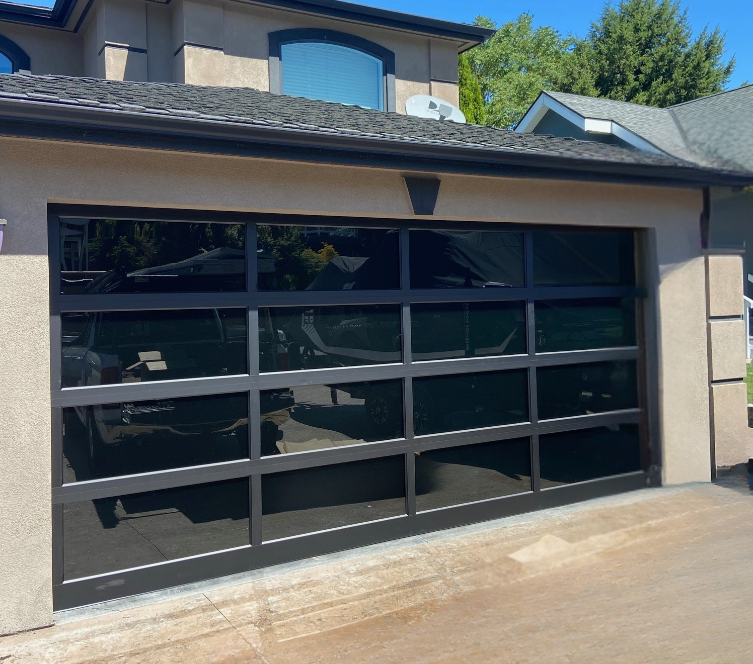 Close-up of a black-frame frosted glass garage door