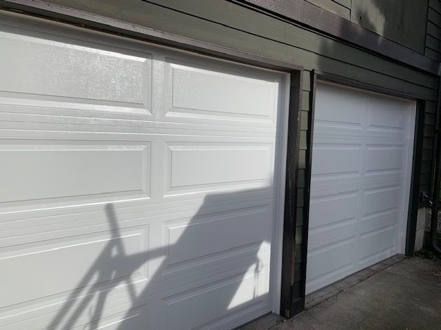 Close-up of a white traditional steel garage door