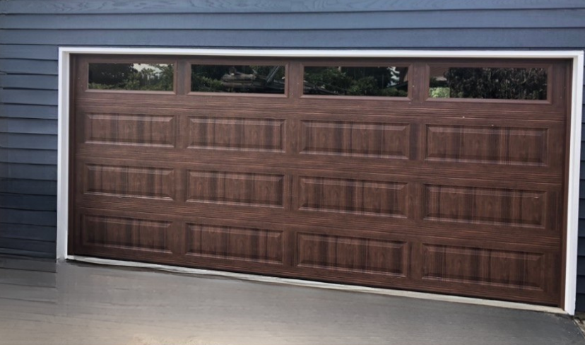 Close-up of a walnut-stained traditional steel garage door
