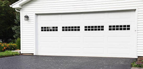 White traditional steel garage door with small square windows
