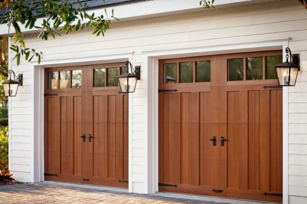 Two-car garage with warm wood-tone carriage house garage doors