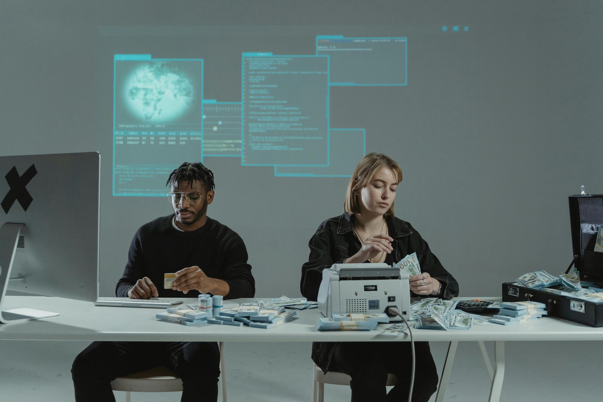 Two medical billing professionals analyzing workers’ comp claims data on screen, highlighting paymen
