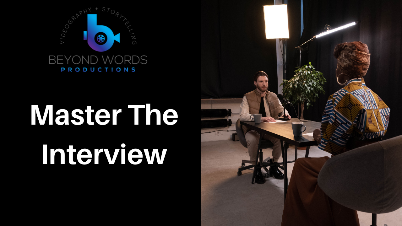 A man is sitting at a table talking to a woman.