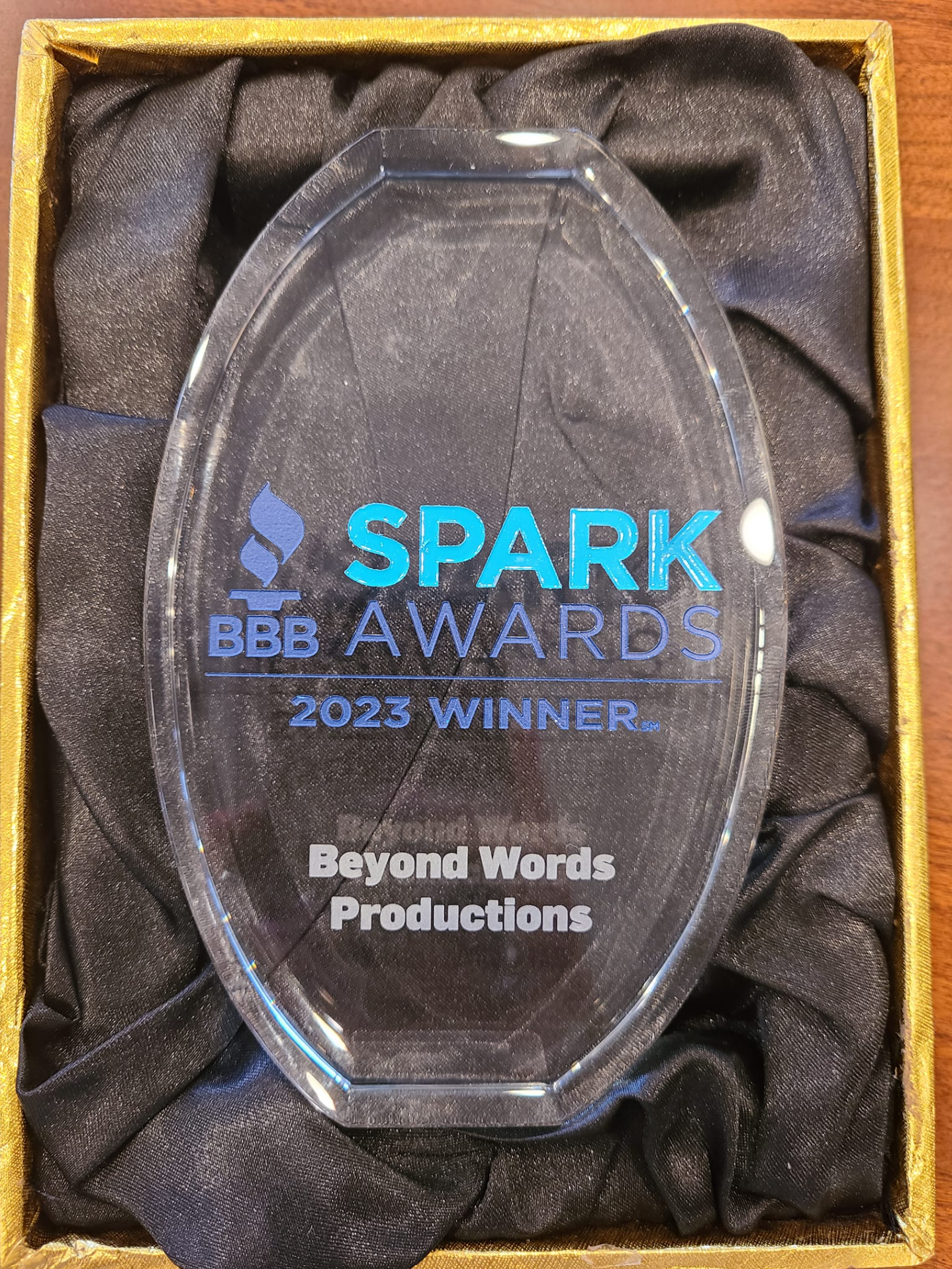 SPARK Awards 2023 winner plaque for Beyond Words Productions in a black satin-lined box SPARK Awards 2023 winner plaque for Beyond Words Productions in a black satin-lined box