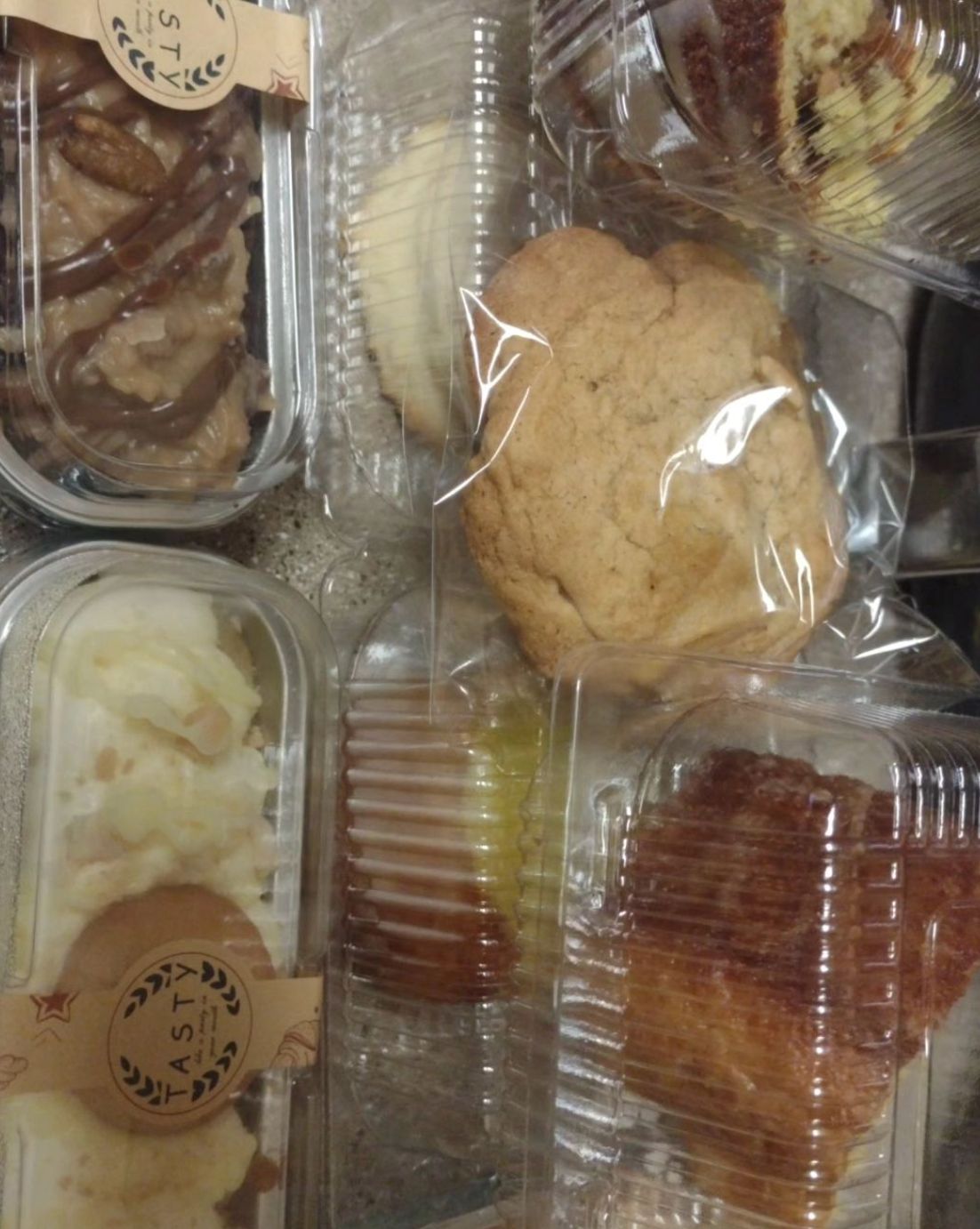 A bunch of plastic containers filled with different types of food