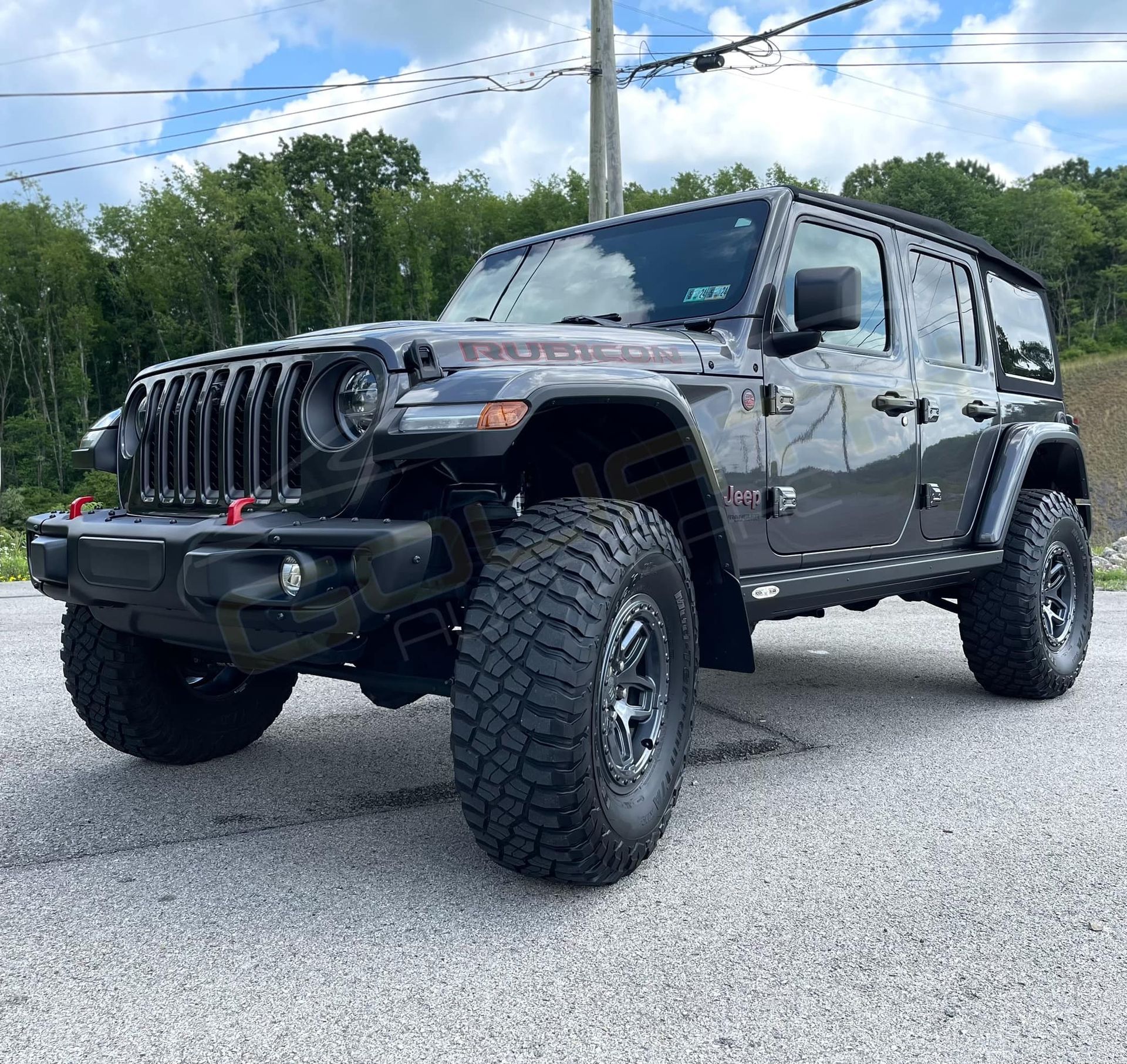 a jeep wrangler is parked on the side of the road .