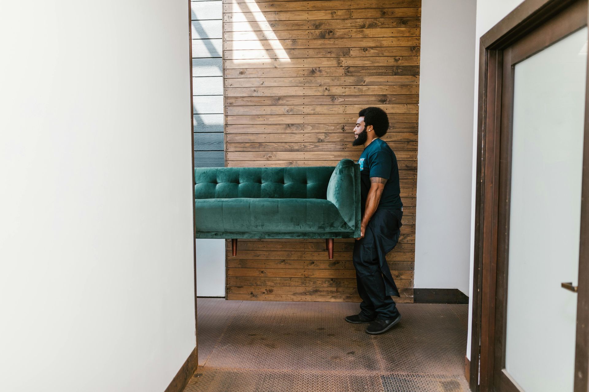 man moving sofa