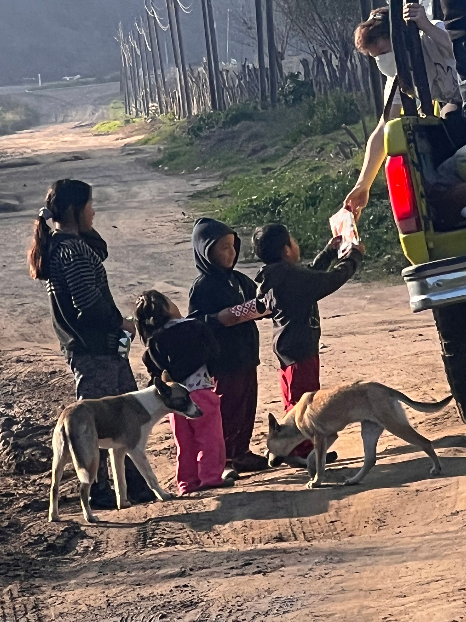 Children receive gifts in rural La Mision, Baja California