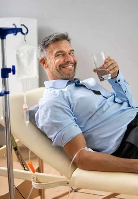 Man staying hydrated during an IV therapy session