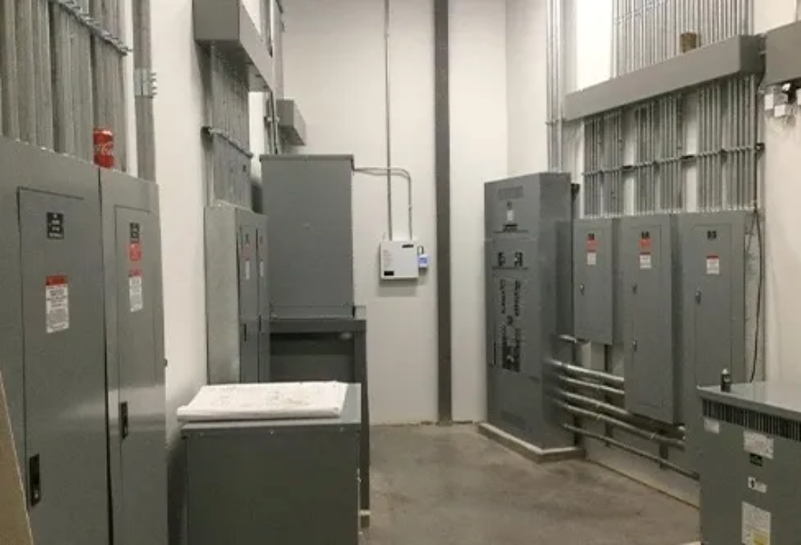 A room filled with lots of electrical panels and boxes.