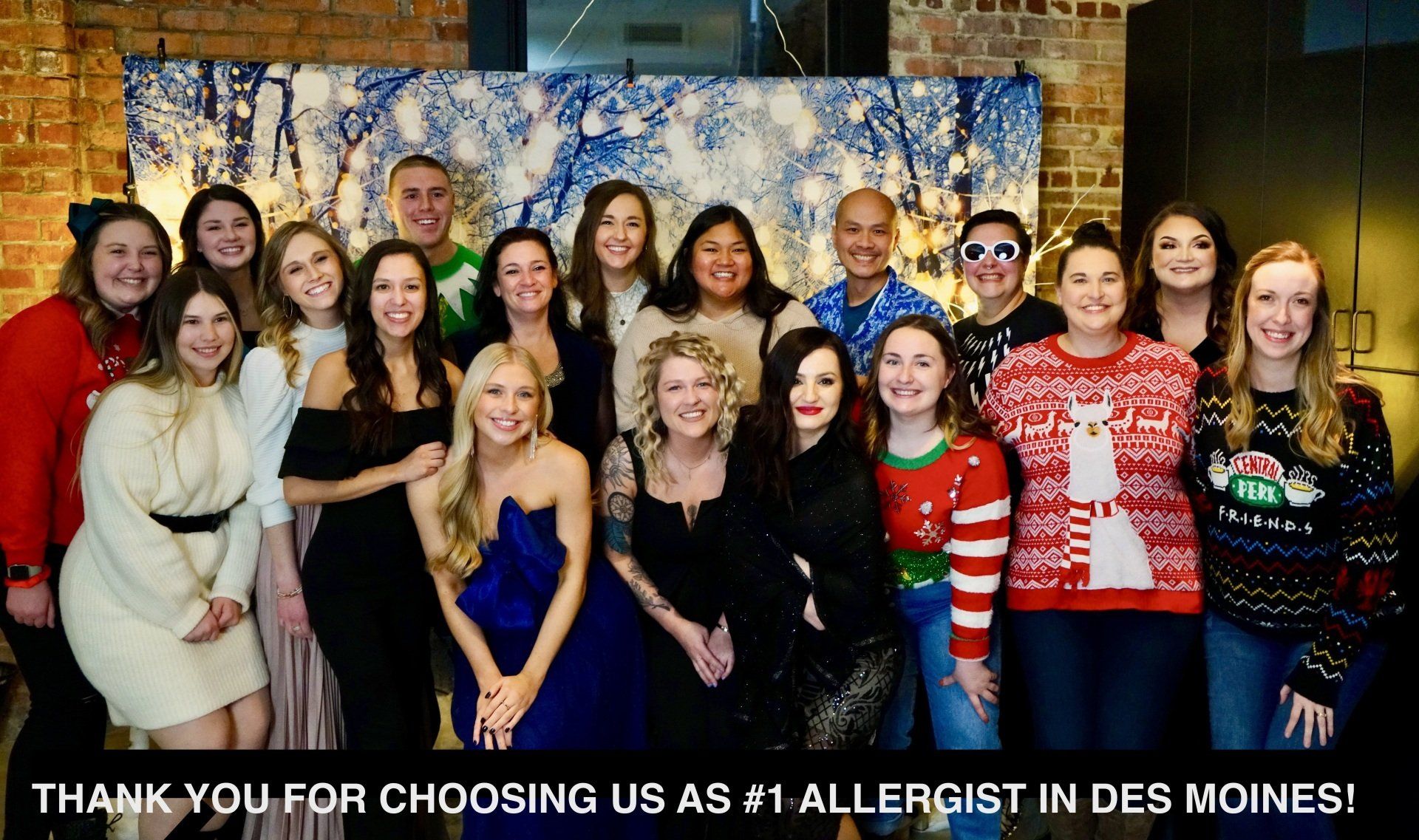 group photo of the Iowa Allergy team at a holiday celebration