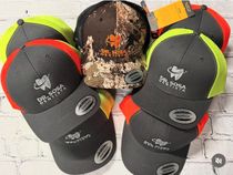 Group of embroidered dental office caps in assorted colors
