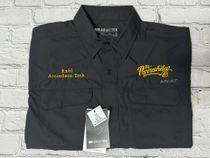 Black button-up work shirt with embroidered name and logo, workwear style