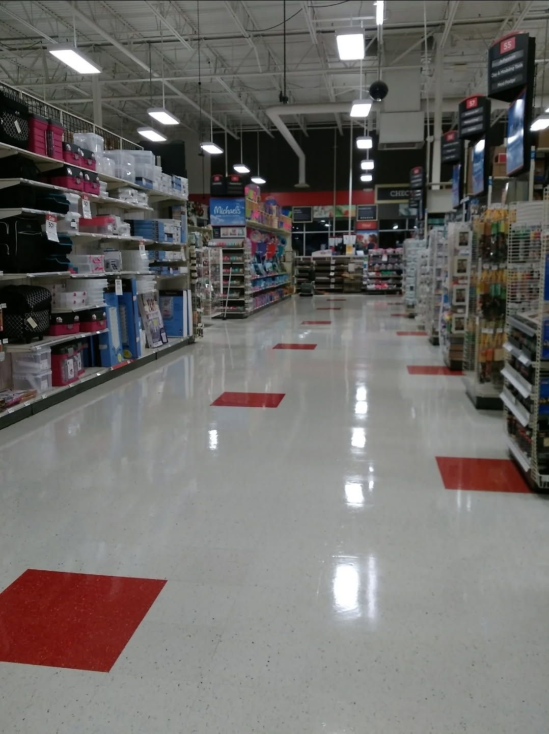 The inside of a store with red and white tiles