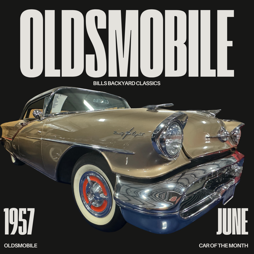 1957 Oldsmobile, gold body, chrome trim, and whitewall tires. 