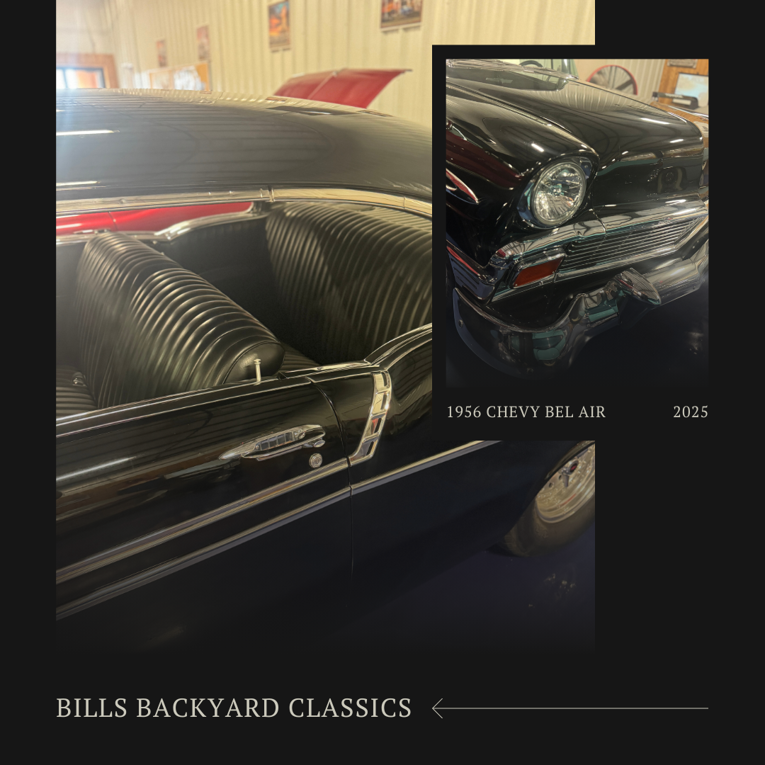Black classic car with a close-up of the front, in an indoor setting.