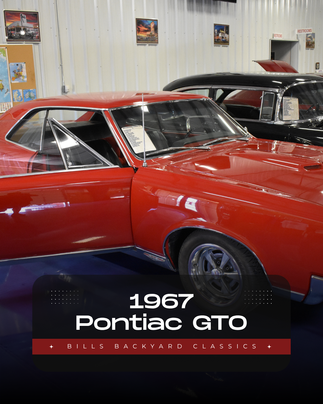 Red 1967 Pontiac GTO in a garage, with a black car partially visible behind it.
