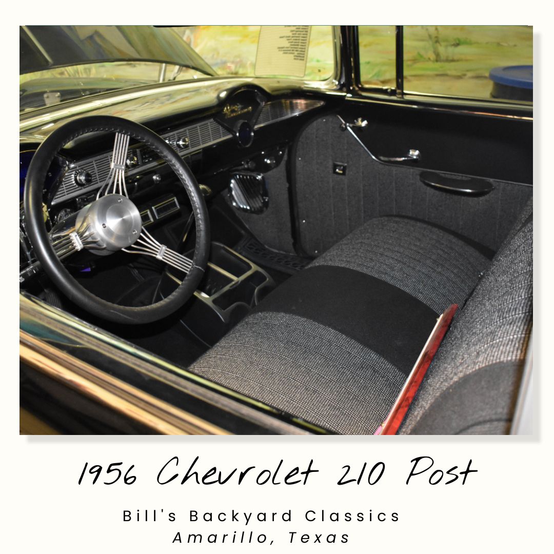 Interior of a classic 1956 Chevrolet 210 Post. Black and gray interior with a custom steering wheel. Amarillo, Texas.