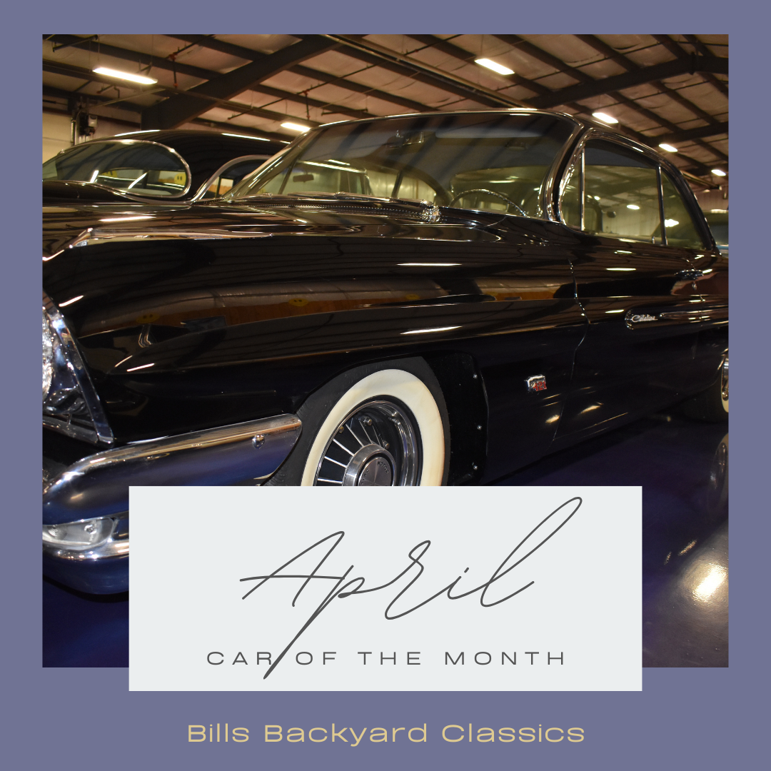 Black classic car with white-wall tires, 
