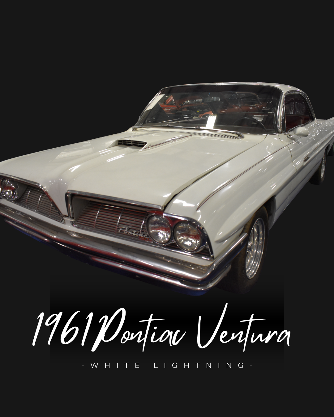 White 1961 Pontiac Ventura classic car on display, against a dark background.