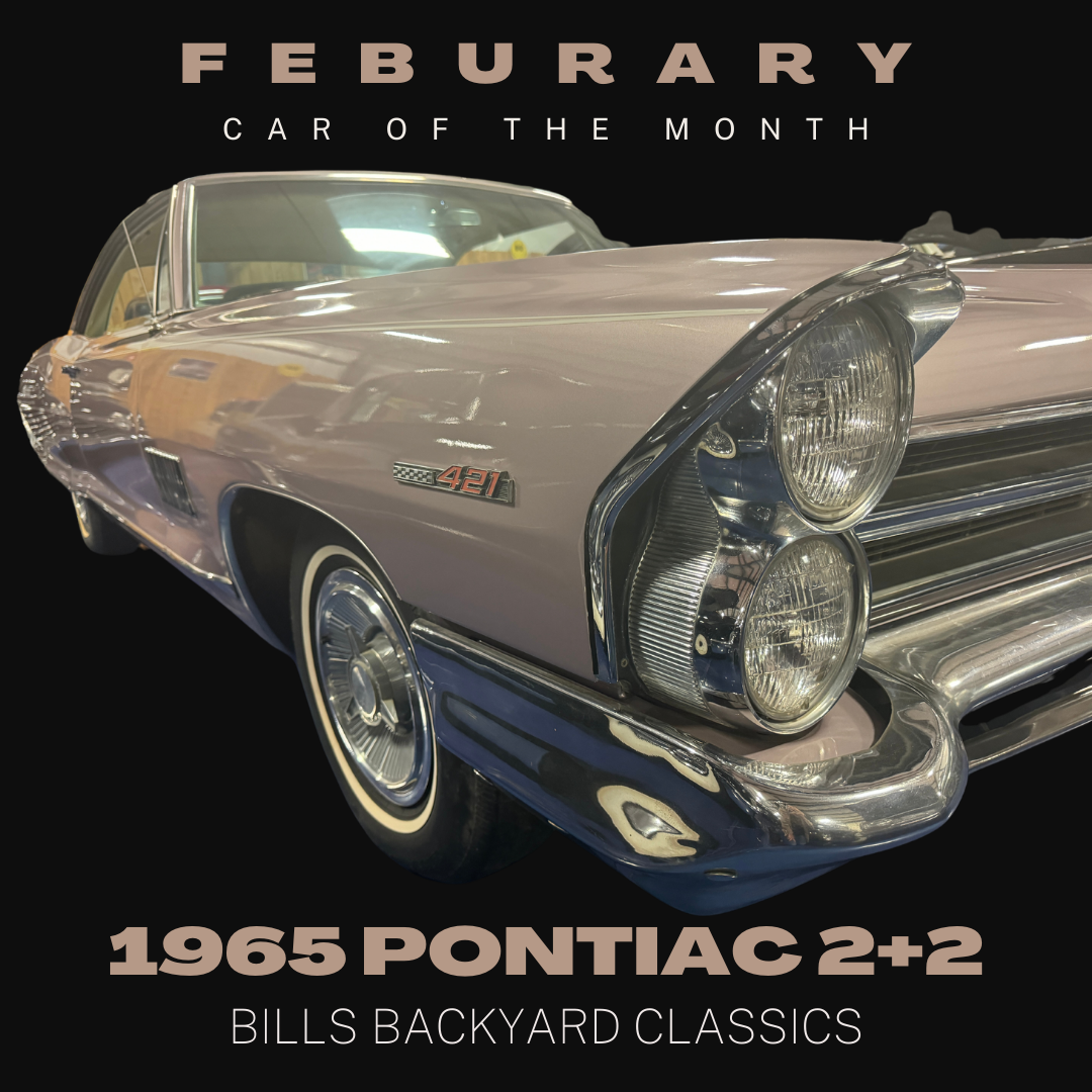 1965 Pontiac 2+2, featured as February's car of the month. Pink car, chrome details, and 