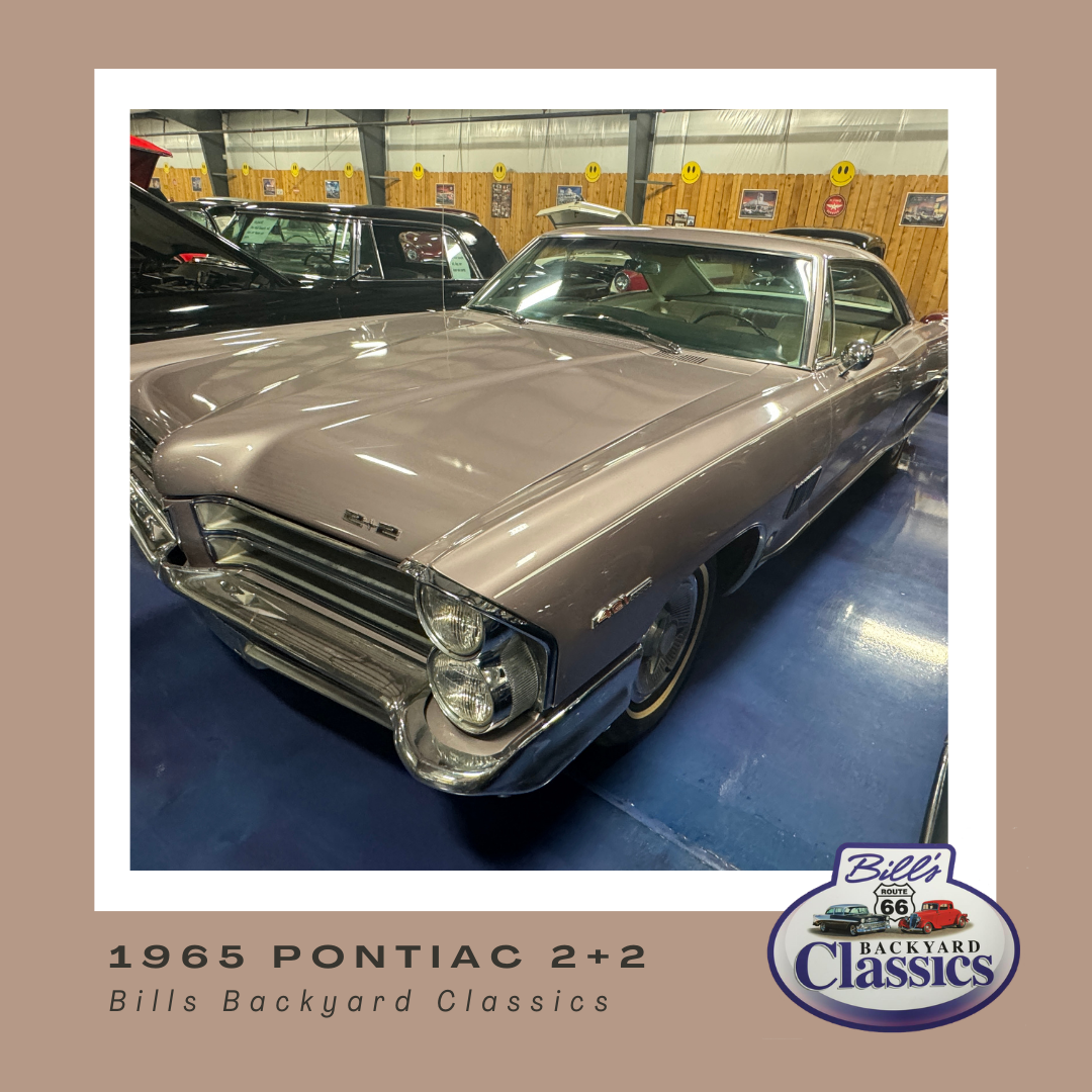 1966 Pontiac 2+2 car, silver-purple with chrome. Inside Bills Backyard Classics.
