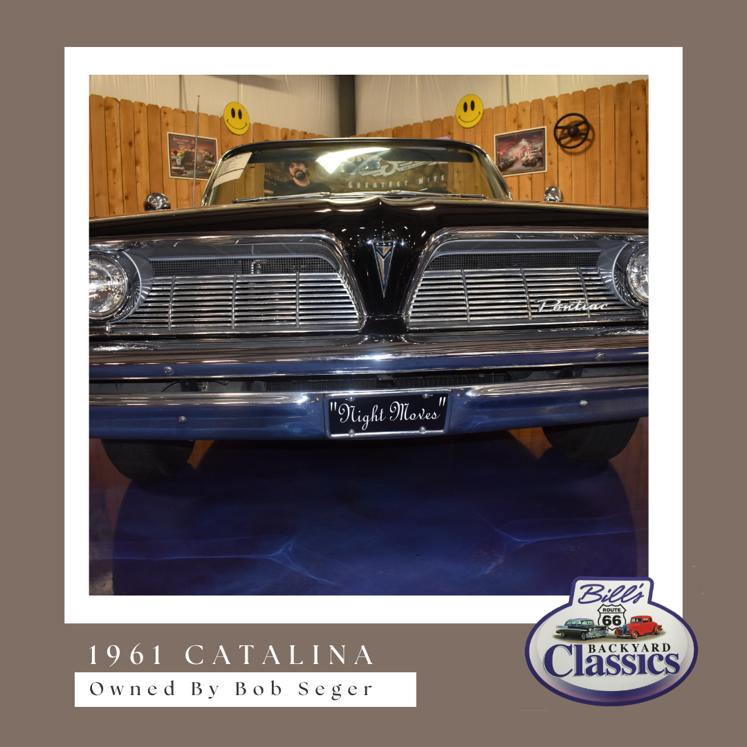Black 1961 Pontiac Catalina. Front view of the classic car. Displayed in a showroom.