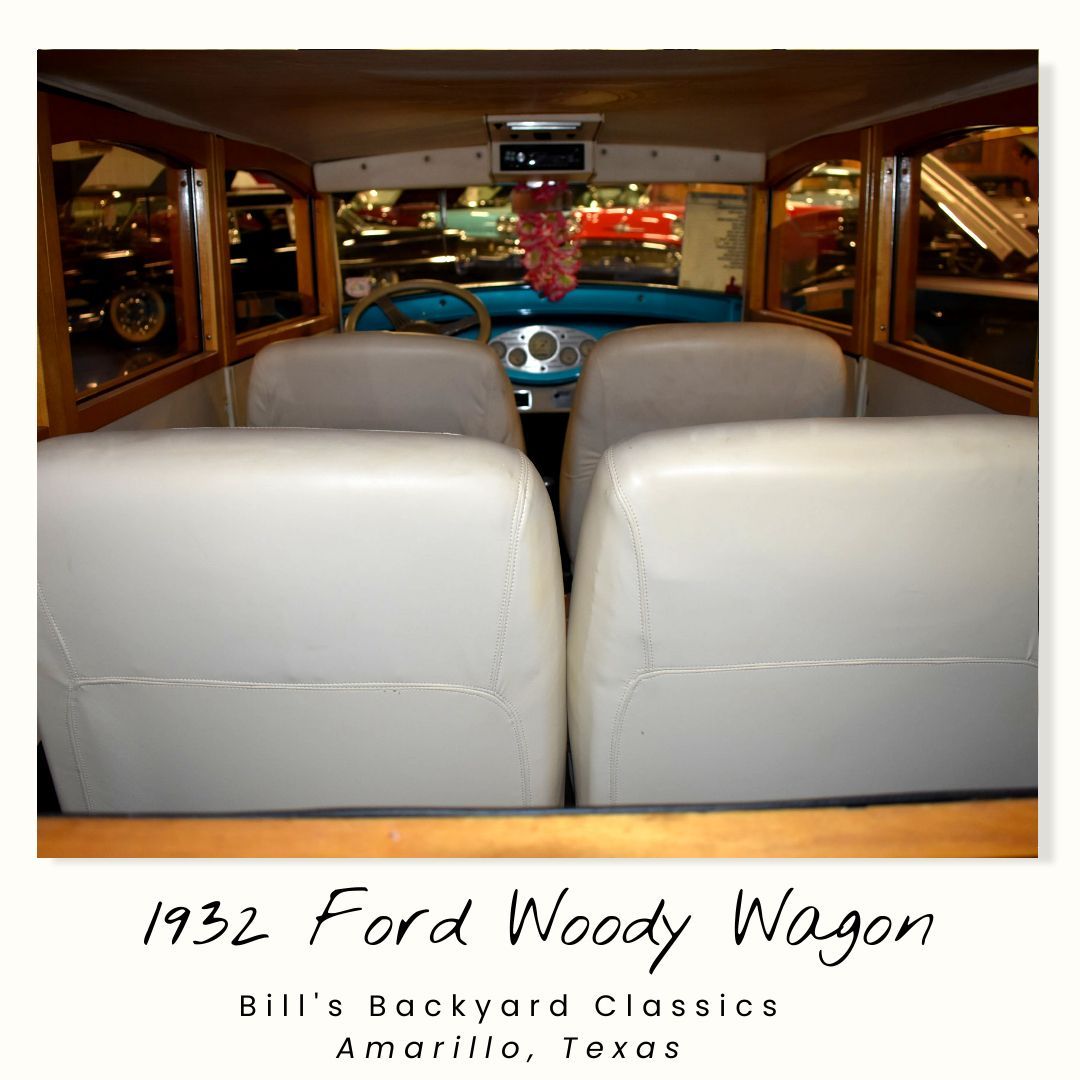 Interior view of a beige-seated 1932 Ford Woody Wagon on display at Bill's Backyard Classics in Amarillo, Texas.
