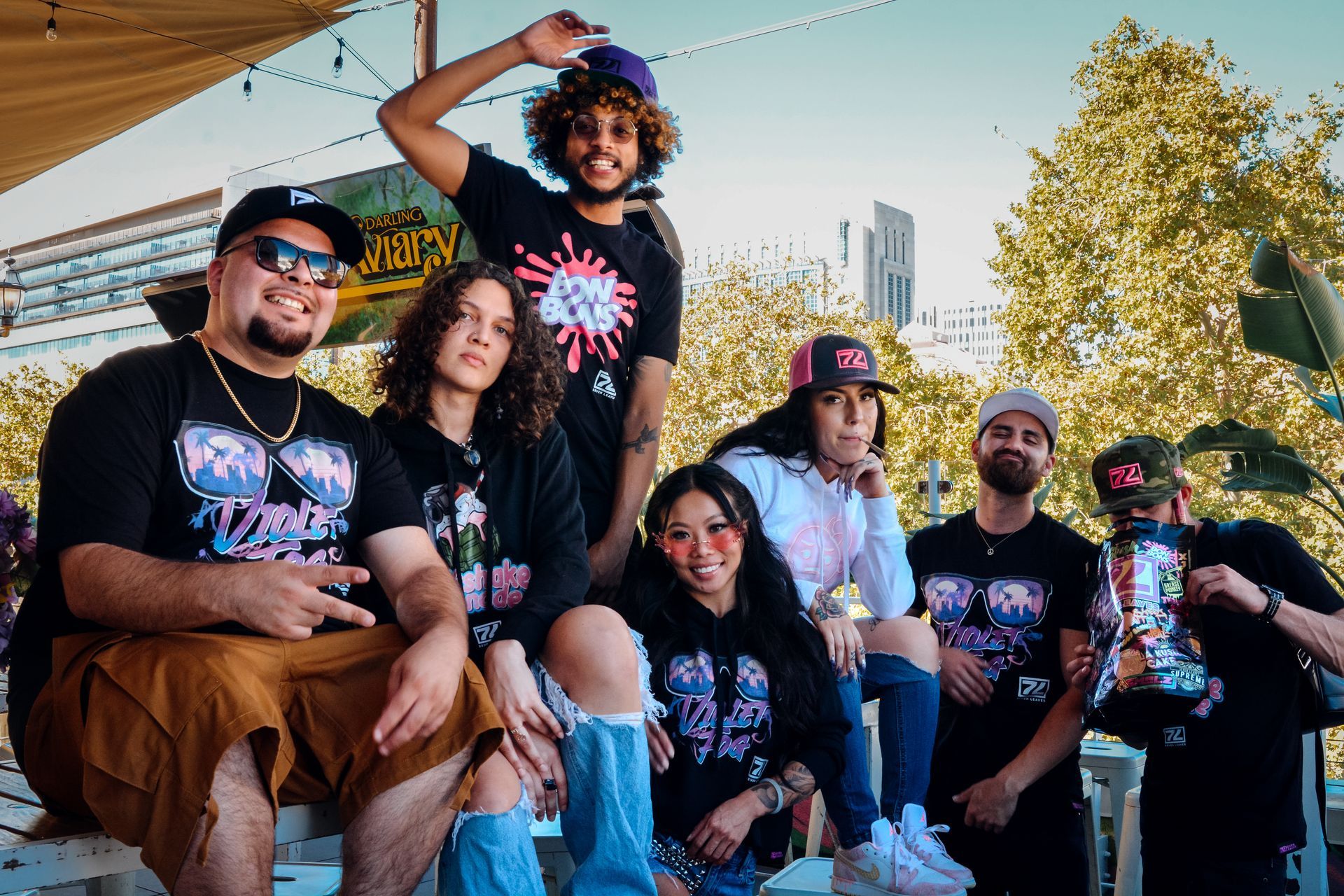 a group of people are posing for a picture together
