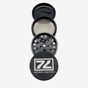 Black Seven Leaves herb grinder, disassembled into its four components.