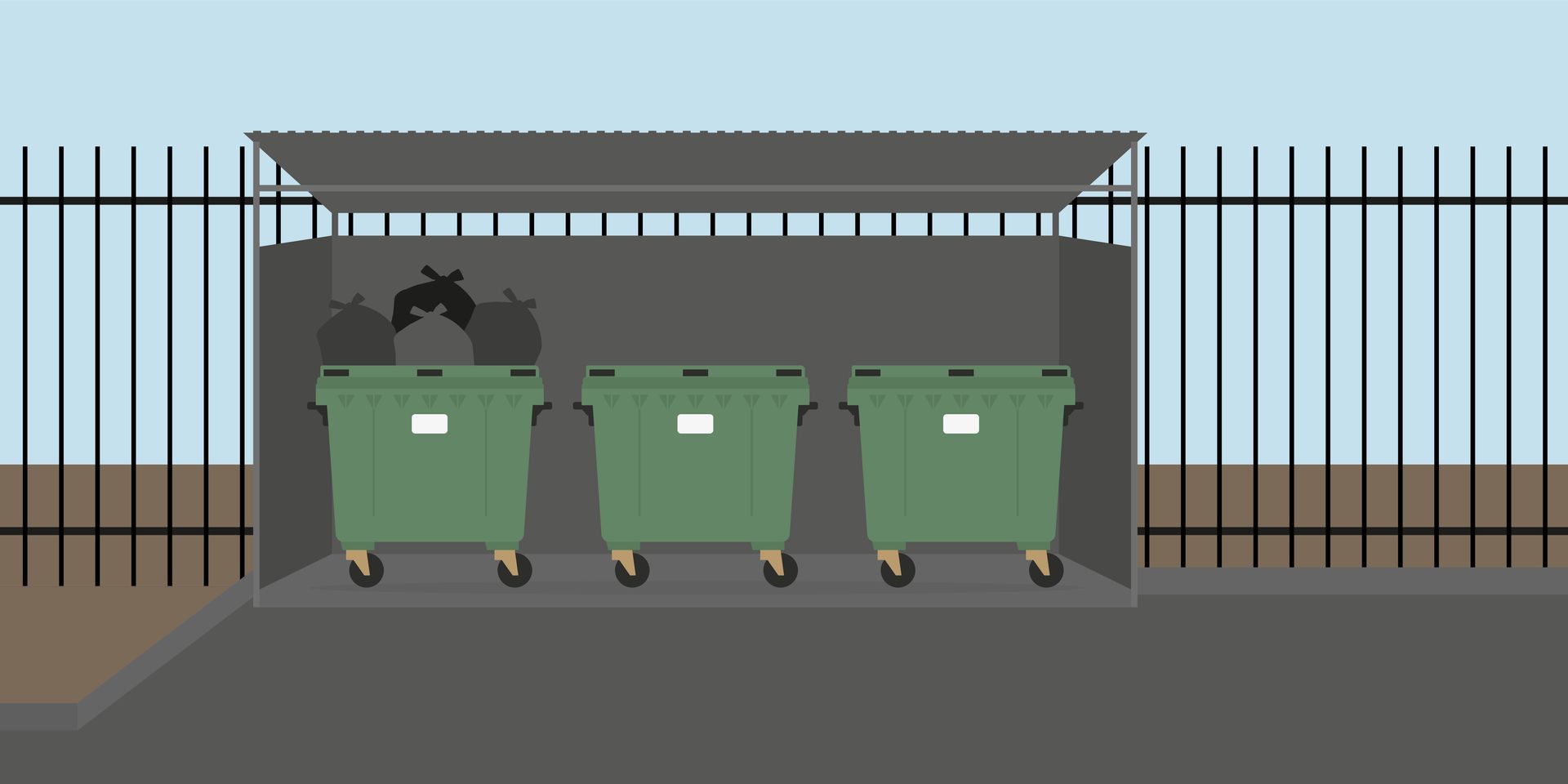 Three green garbage cans are lined up in a shed behind a fence.