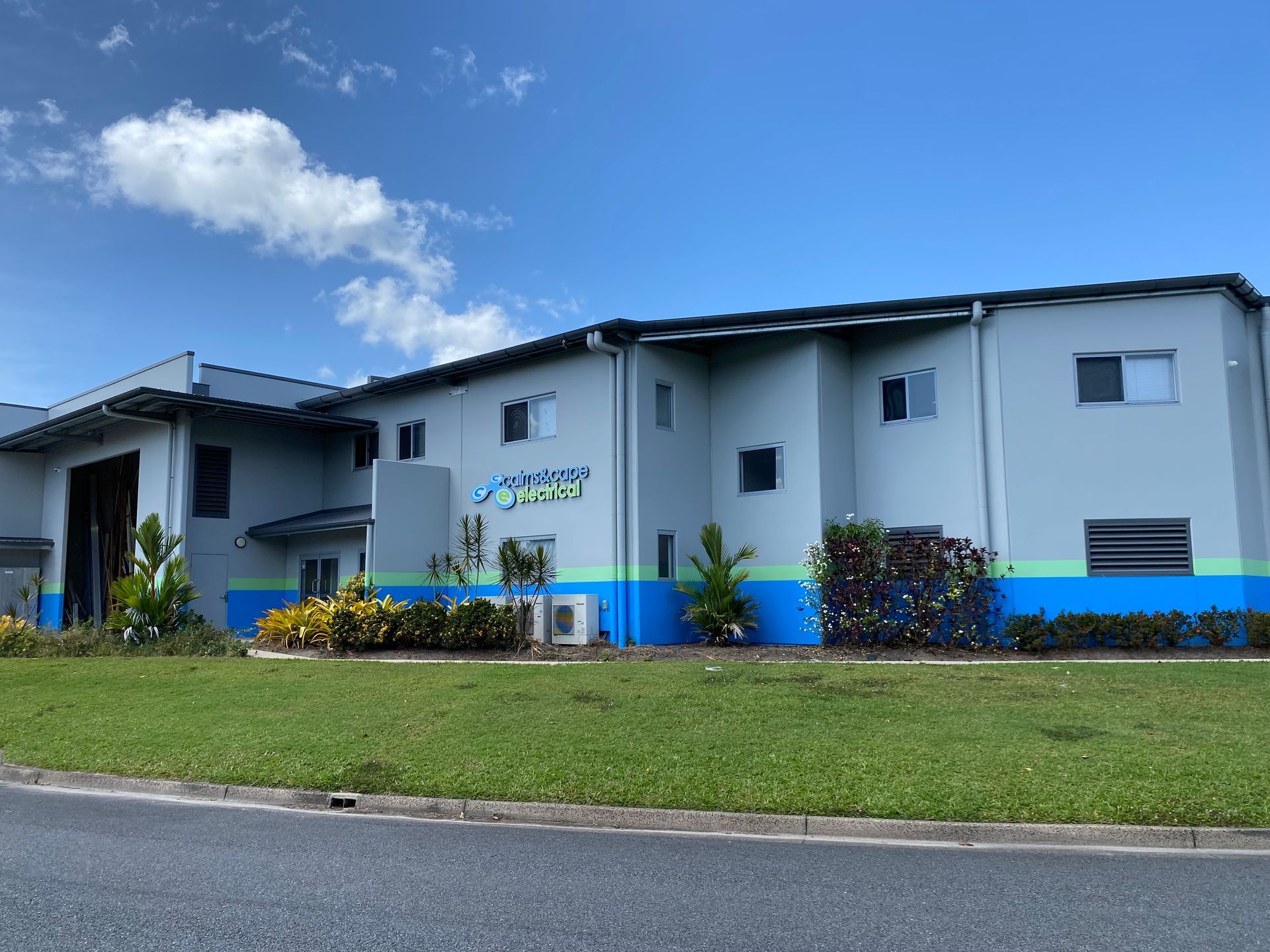 Man Checking The Air Conditioner Using Digital Tools — Cairns & Cape Electrical In Woree, QLD