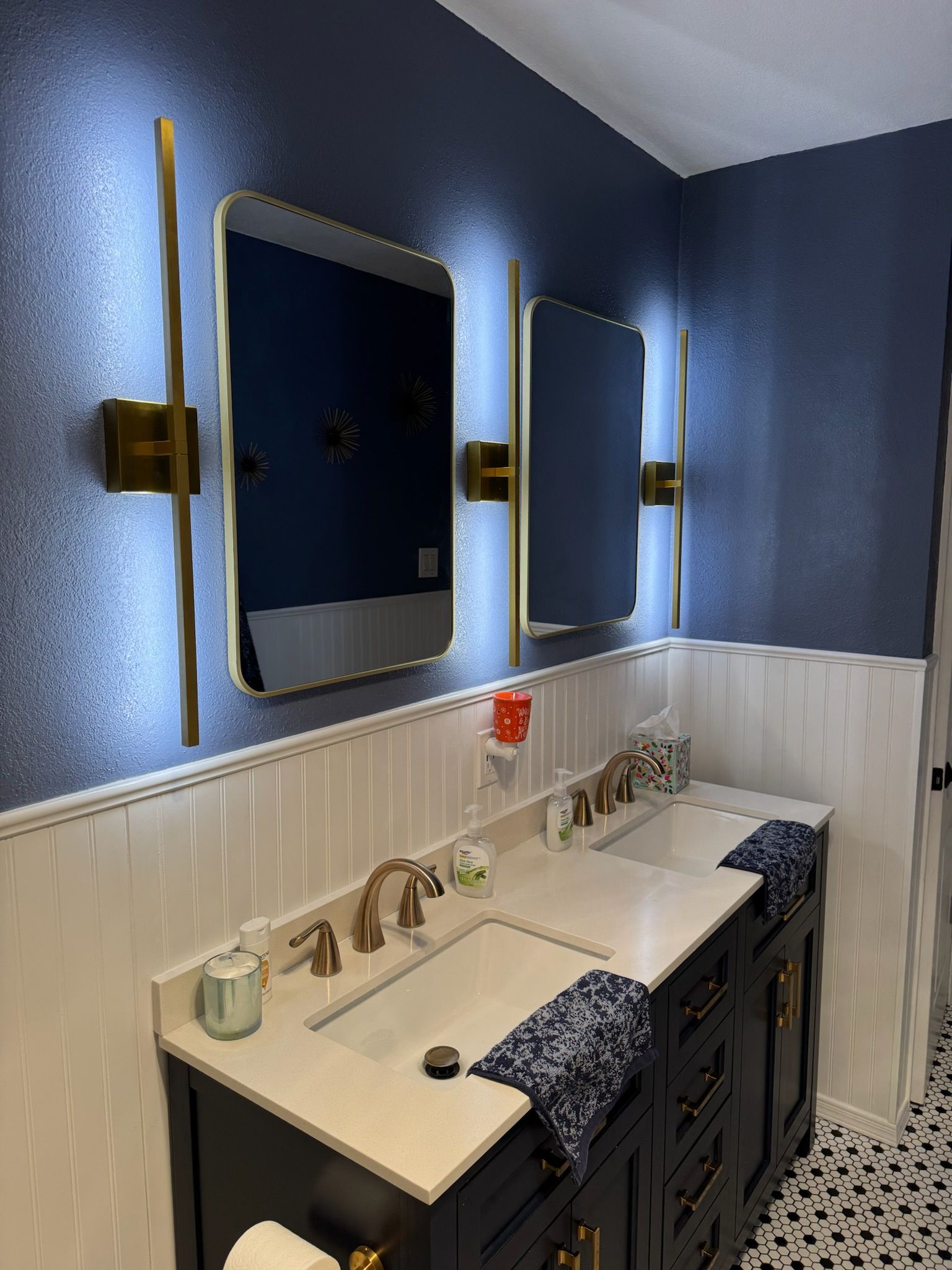 A bathroom with a bathtub , sink , and shower.