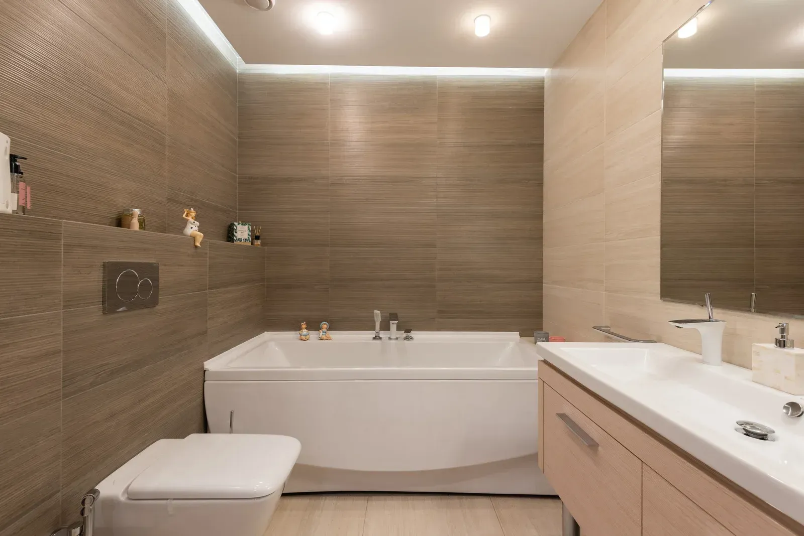 A white bathtub with a walk in door in a bathroom.