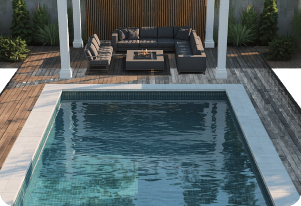 A rectangular swimming pool fronting a deck with a grey sectional sofa, coffee table, and pergola under a slatted wall.
