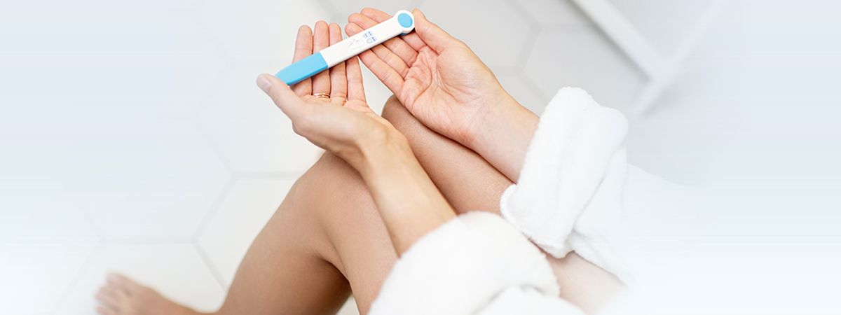 Woman checking a pregnancy test after unprotected sex, considering emergency contraception in Seoul