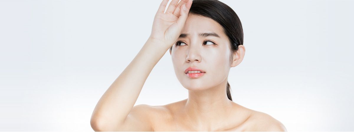 Woman tired from heavy menstrual bleeding and hormonal symptoms