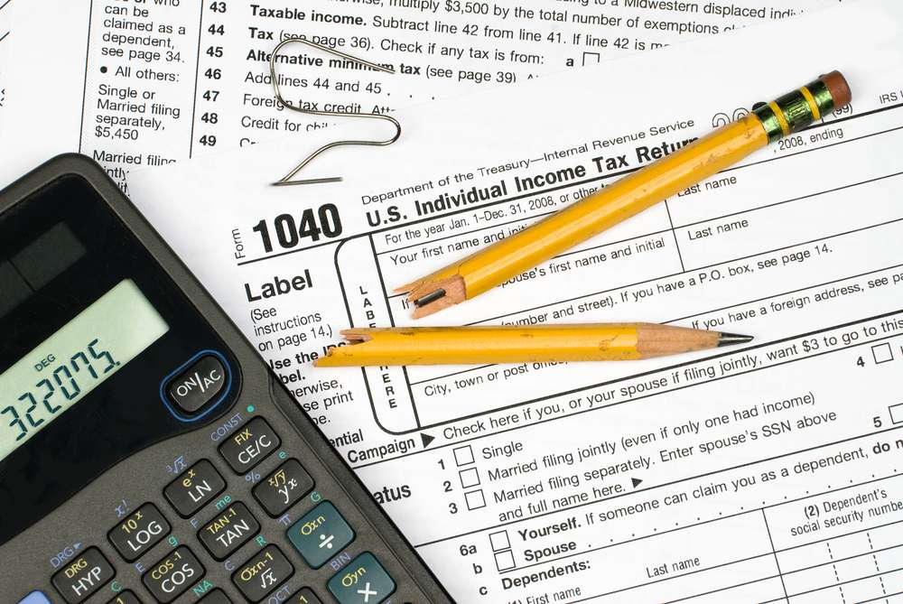 Calculator And Broken Pencil Placed On Paper In Table