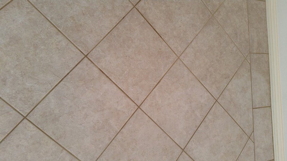 A close up of a tiled floor with a diamond pattern. — Lake Macquarie Carpet Cleaning In Warners Bay, NSW