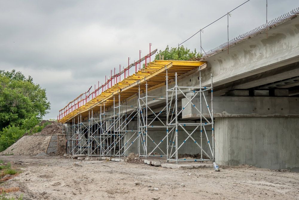 A Bridge Under Construction with Scaffolding and A Fence — FBM Fabrication In Dapto, NSW