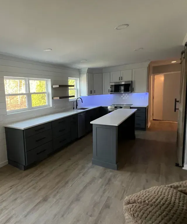 A Kitchen with A Large Island in The Middle of The Room.