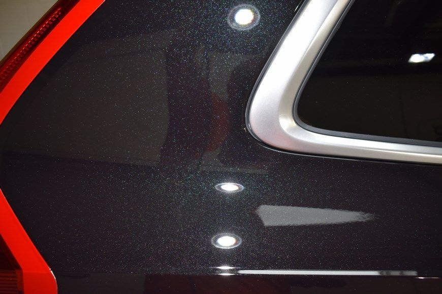 A black car with a red stripe on the side