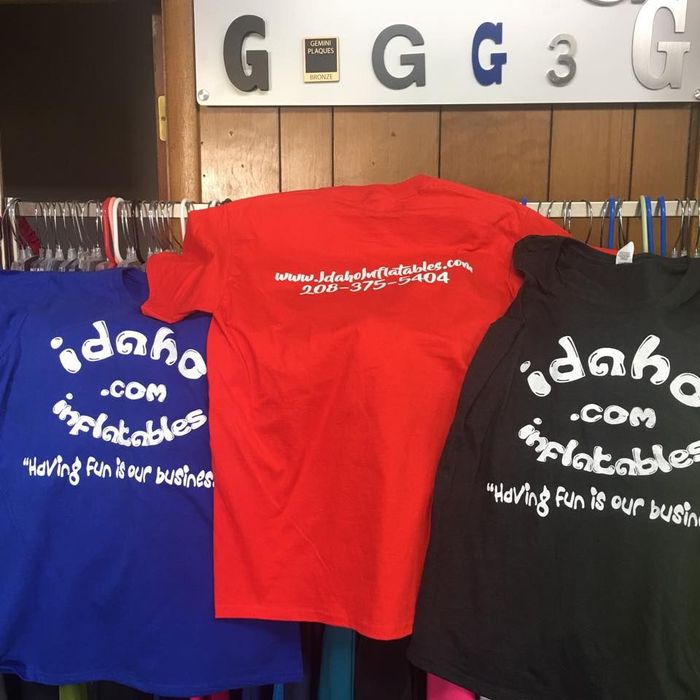 Three shirts with the text 