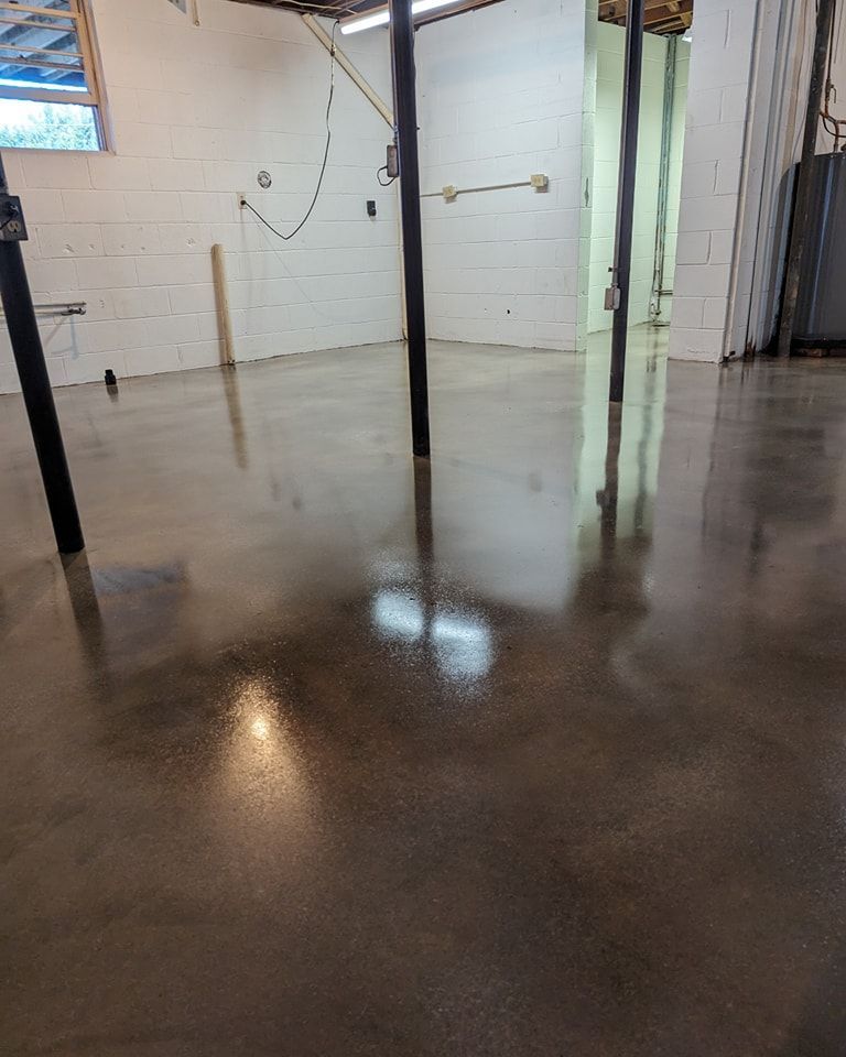 A garage with a concrete floor and a door.
