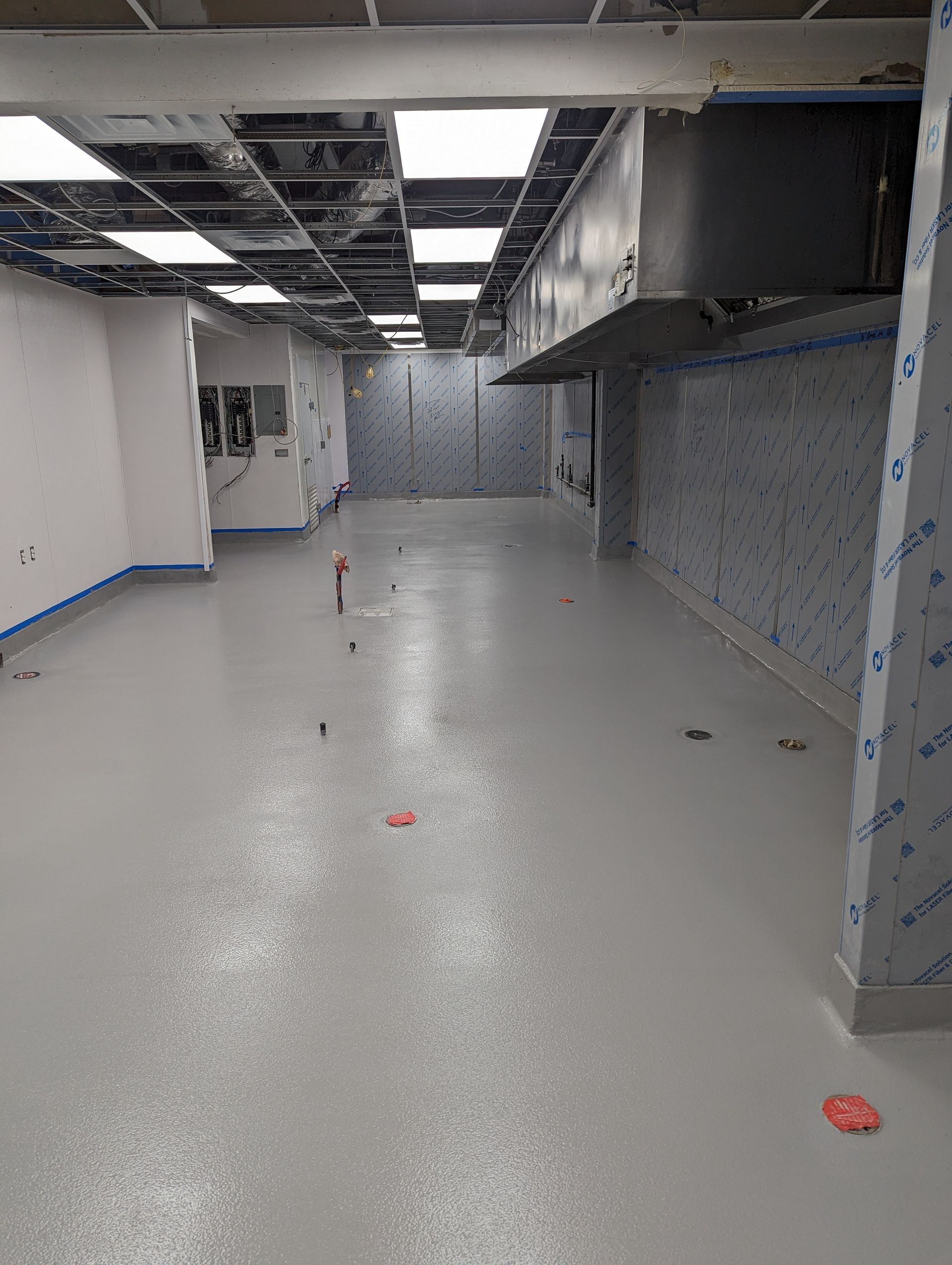 A large room with a lot of lines on the floor.