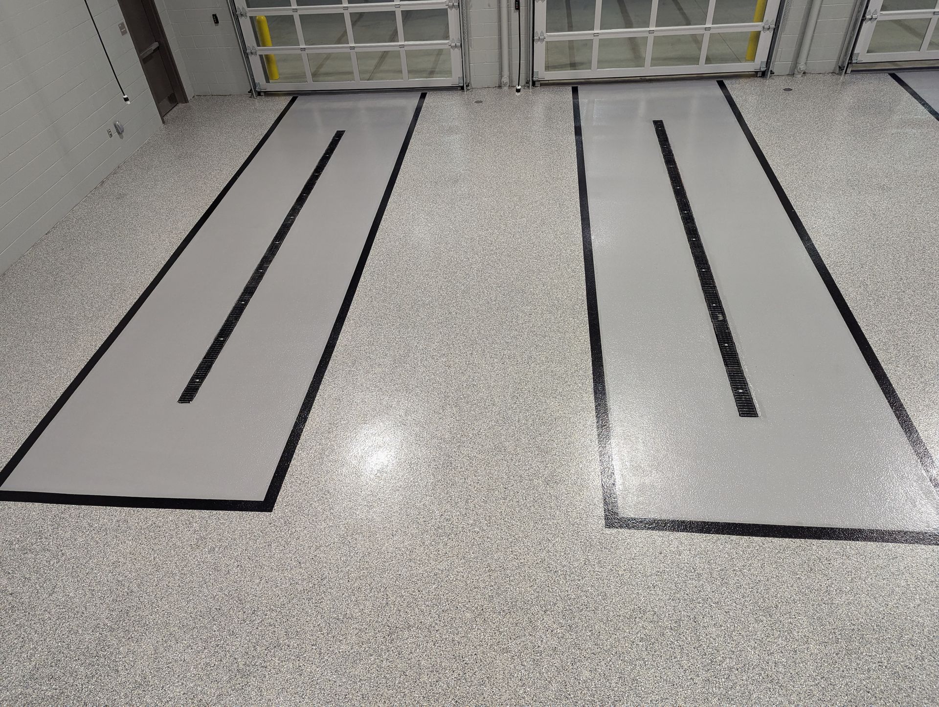 There are two lines on the floor that look like a road.